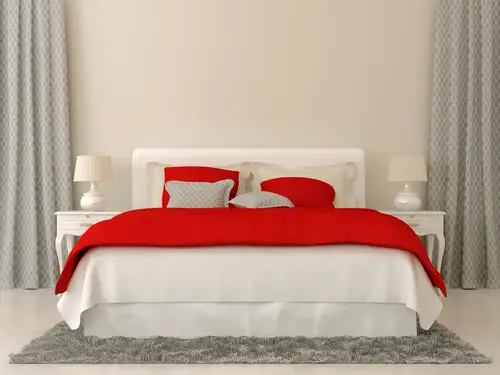 Red Comforter in White Bedroom
