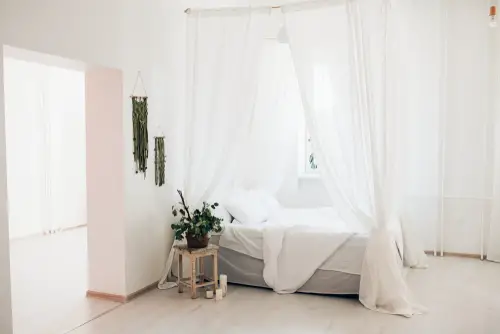 White Scandinavian Canopy Bed with Romantic Vibe