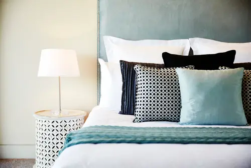Contemporary Teal Bedroom with Padded Headboard