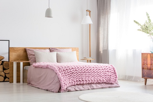 Scandinavian Bedrooms in Light Lilac with Knitted Blanket