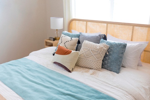 Beach House Bedrooms in Ice Blue with Knitted Pillows 