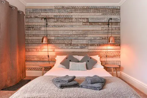 Rustic Bedrooms in Light Gray with Wooden Headboard 