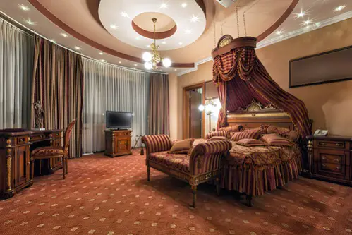 Hollywood Regency Bedrooms in Elegant Maroon